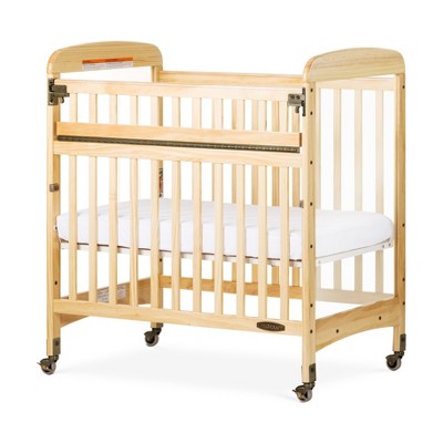 Child Craft Avery SafeAccess Wooden Compact Portable Crib, 2 Easy Roll Locking Wheels, Durable Wood Construction, Fits Through Doorways (Natural)
