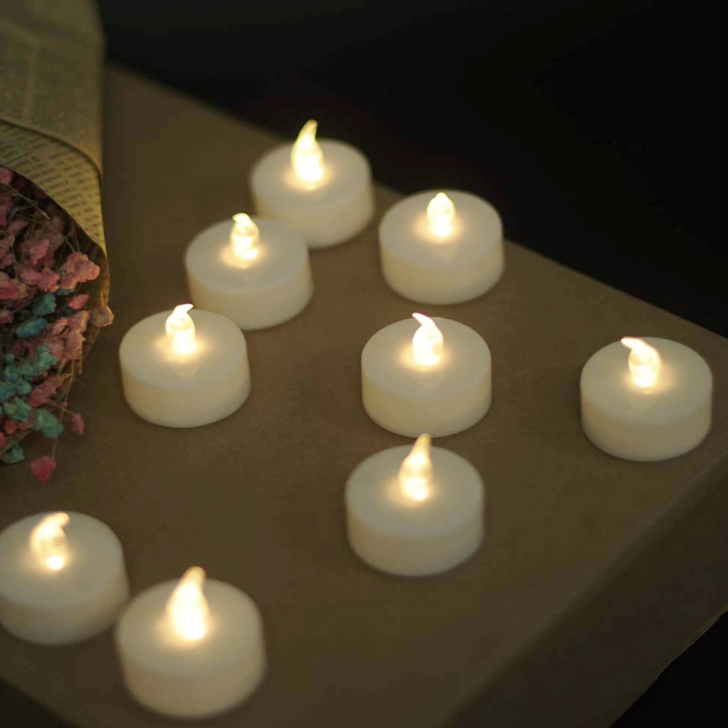 YIWER Flameless Tea Lights Candles - Realistic LED Flickering Operated Tea Lights Battery Tealights Long Lasting Electric Fake Candles in Warm White 200pcs Decoration for Party and Gifts Ideas