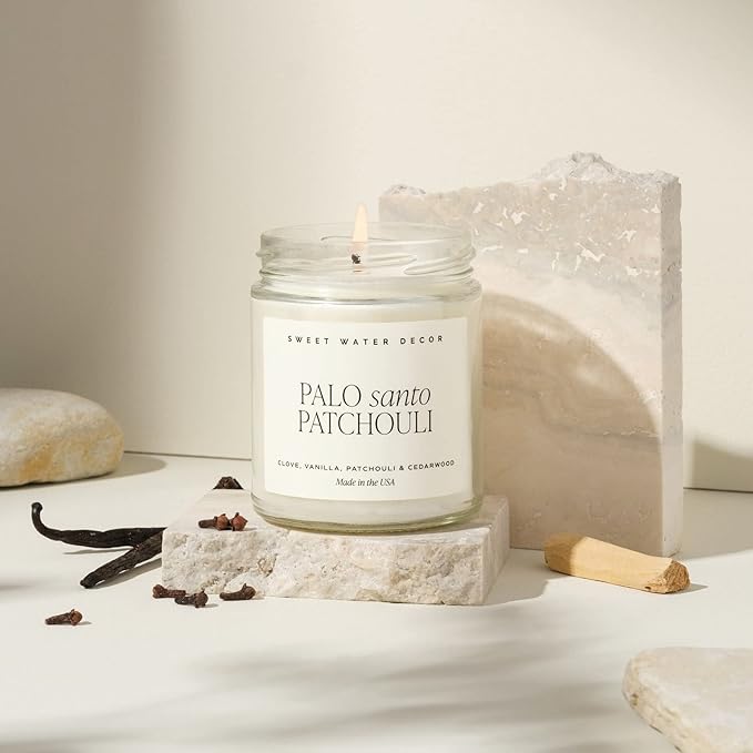 Sweet Water Decor Palo Santo Patchouli Candle - Soy Clove, Vanilla, Patchouli, Cedarwood Scented Spa Candles for Home -9oz Clear Jar + Gold Lid, 40+ Hour Burn Time, Made in The USA
