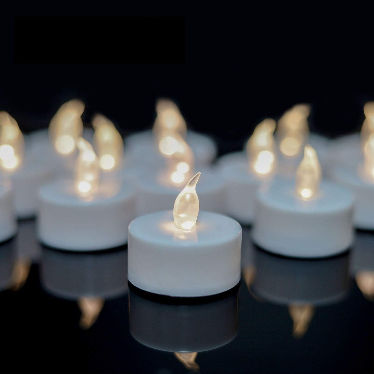 YIWER Flameless Tea Lights Candles - Realistic LED Flickering Operated Tea Lights Battery Tealights Long Lasting Electric Fake Candles in Warm White 200pcs Decoration for Party and Gifts Ideas