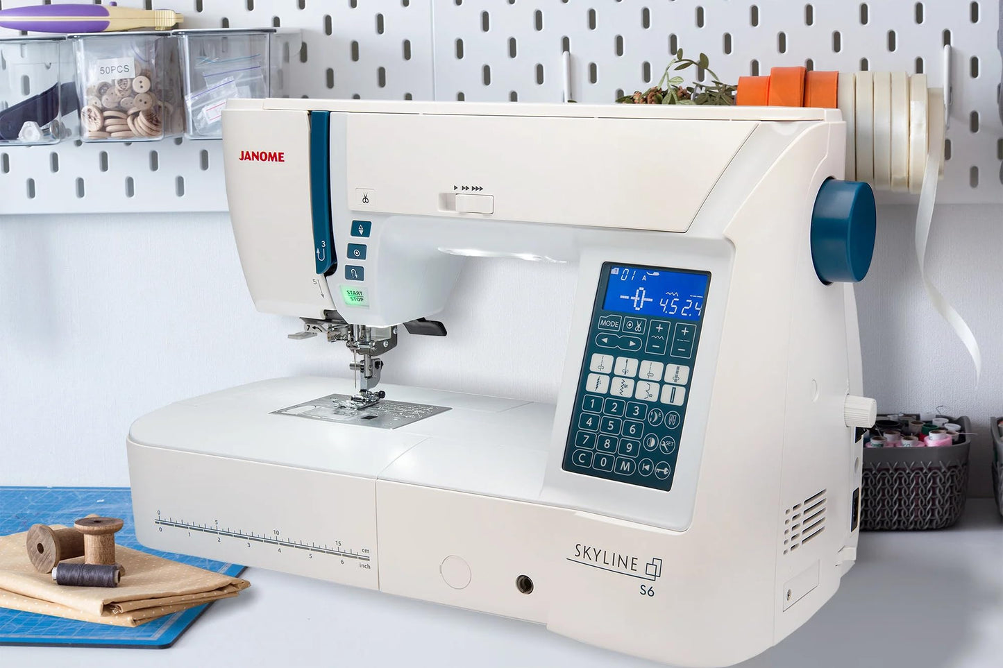 Janome Skyline S6 Sewing and Quilting Machine with 9mm Stitch Width, Mid-Size, White