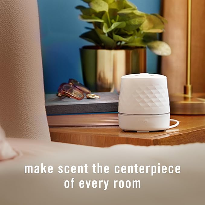 Febreze Plug Scent Booster Starter Kit, Oil Diffuser, Air Freshener Plug in, Giftable for Holidays, Continuous Scent Device + 2 Downy Calm Refills