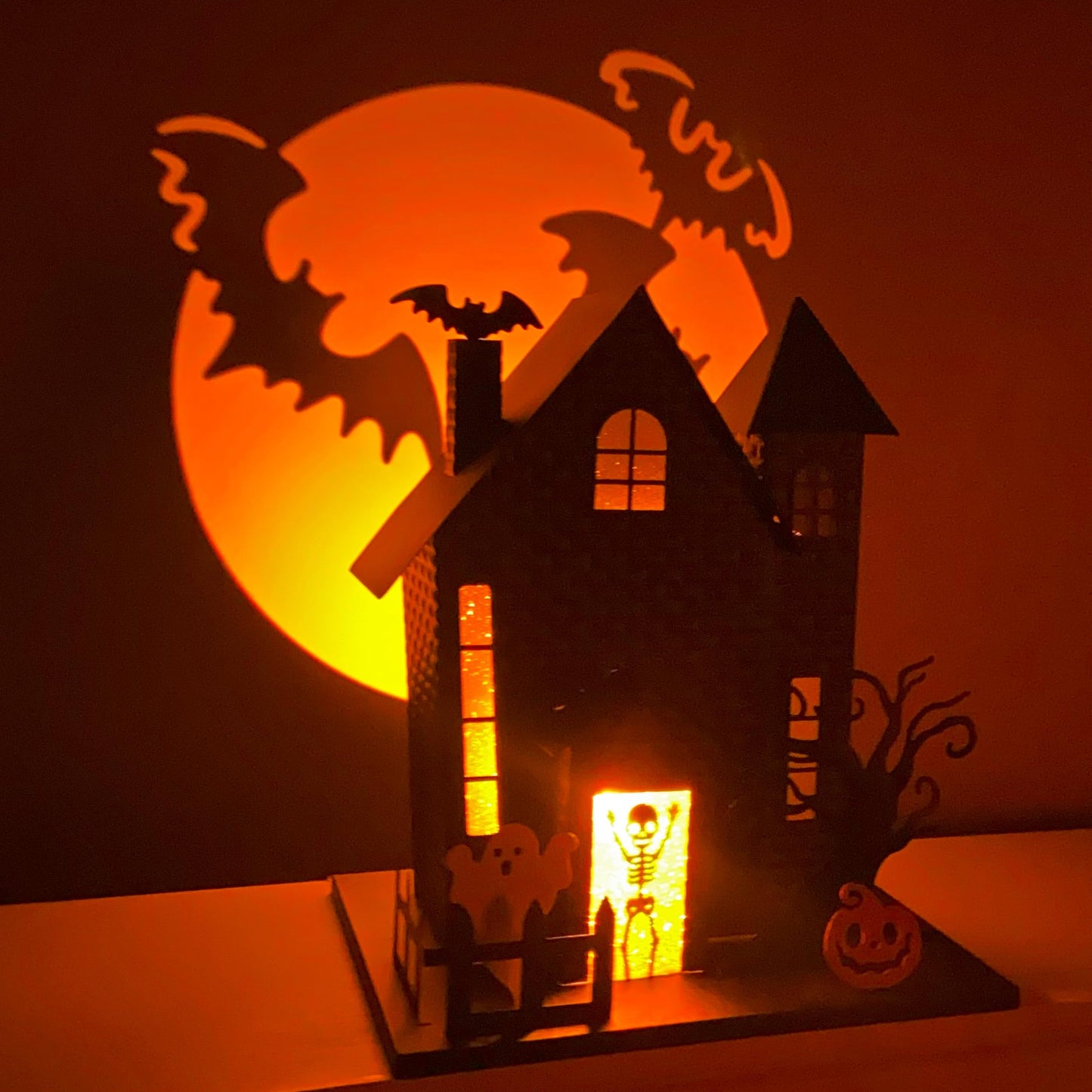 Haute Decor Halloween Haunted House with Bat Projection - Unique Lighted Black Metal Haunted House for Tabletop Halloween Decoration